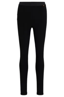 Pantalones extra slim fit en punto con elástico