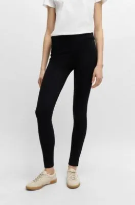 Pantalones extra slim fit en punto con elástico