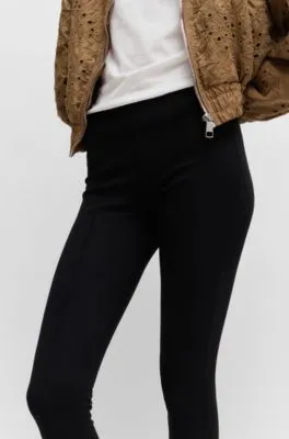 Pantalones extra slim fit en punto con elástico
