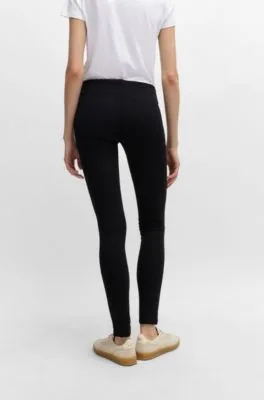 Pantalones extra slim fit en punto con elástico