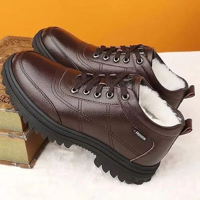 Zapatos de algodón de hombre gruesos acolchados de invierno Cien botas de nieve casuales Zapatos de cuero para hombre